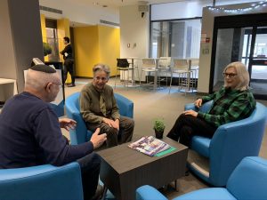 Members of the SAP sitting and talking in a circle