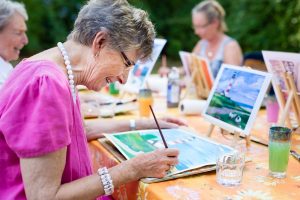 A woman painting a picture.