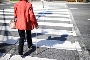 A woman crossing the street